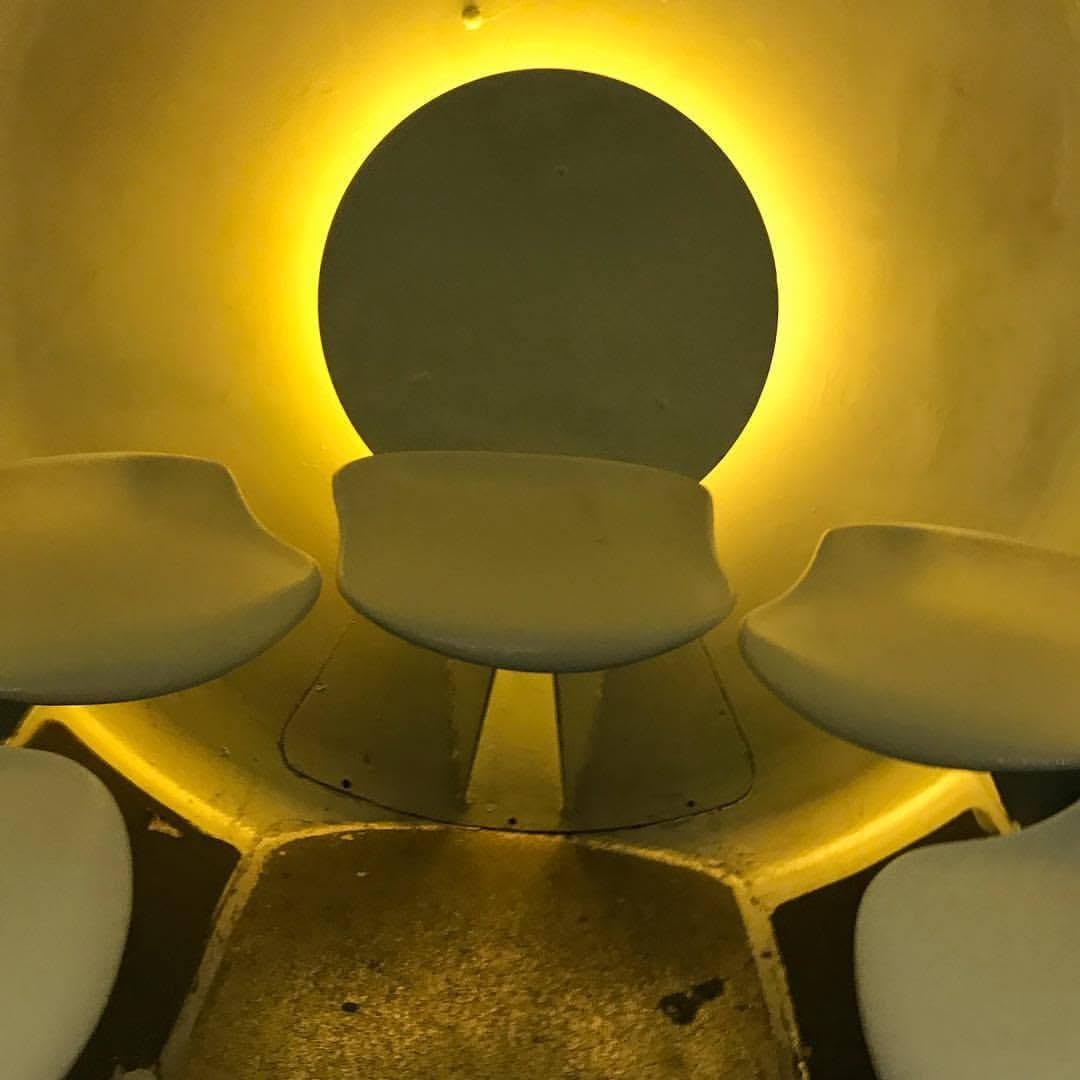 Sculptural architectural lighting fixture with warm amber glow