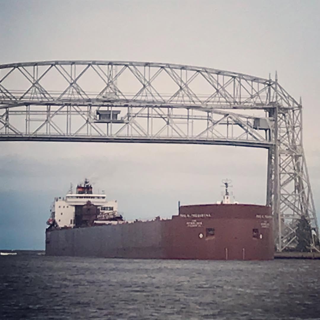 Duluth aerial lift bridge with a freighter passing through the harbor